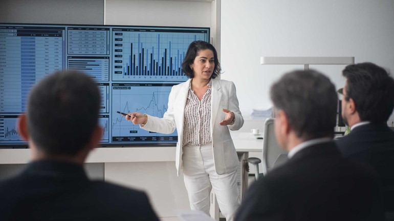 female presenting to colleagues